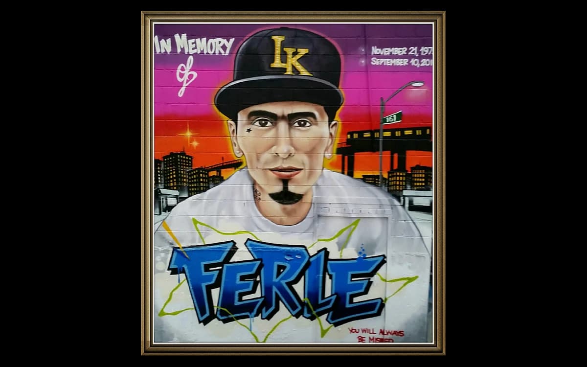 A painted mural of a person in a hat with the name 'Ferle' beneath