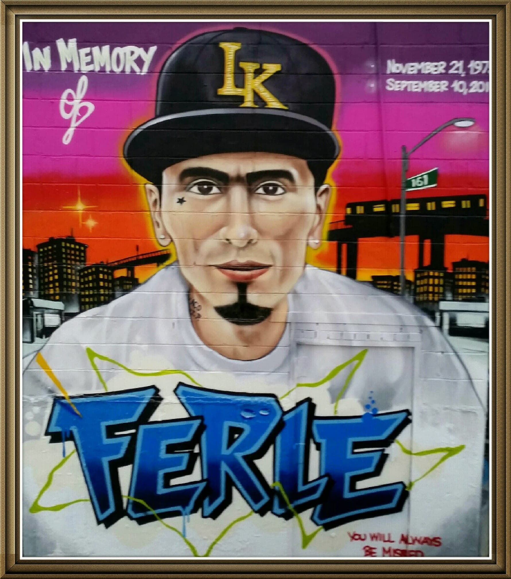 A painted mural of a person in a hat with the name 'Ferle' beneath